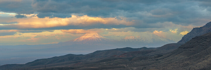 Wide angle panoramic view of winter sunrise over the Ararat mountains. Travel destination Armenia