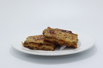 turkish filo pastry with minced meat on white background