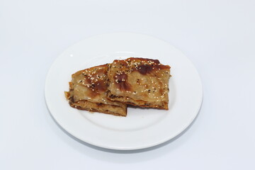 turkish filo pastry with minced meat on white background
