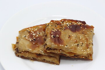 turkish filo pastry with minced meat on white background