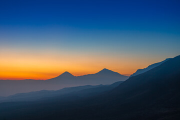Fototapeta na wymiar Colorful sunset over the Ararat mountains with mist over Ararat valley at winter. Travel destination Armenia