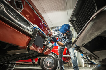 Classic Cars Collector Cleaning on His Vehicle - 701719352