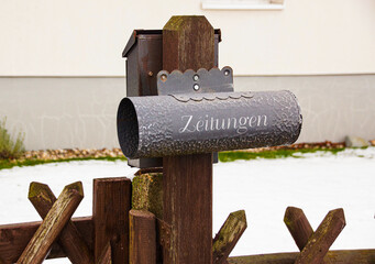 mailbox and a wooden fence