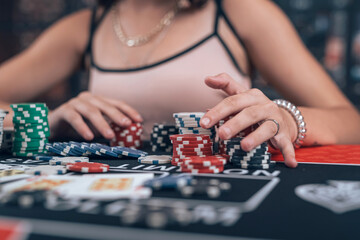Young caucasian woman playing texas hold'em poker at casino
