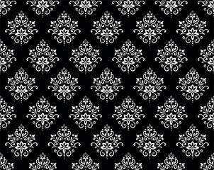 Wallpaper in the style of Baroque. Seamless vector background. White and black floral ornament. Graphic pattern for fabric, wallpaper, packaging. Ornate Damask flower ornament