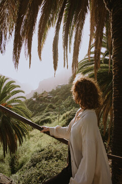 young woman looking on beautiful landscape in the mountains of tenerife.