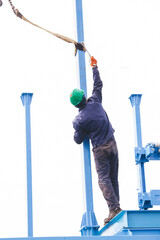 Manual worker working at shipyard construction site