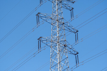 Electric line power tower with blue sky