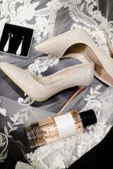 Bride's shoes and perfume bottle