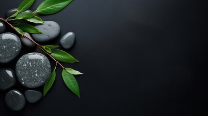 A picture that captures the beauty of a spa with hot stones being viewed from above, with a dark background and a high-end concept. - obrazy, fototapety, plakaty