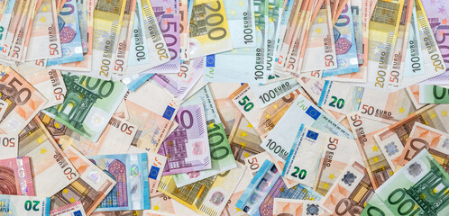 Lot of paper different euro banknotes as finance bachground. Top view