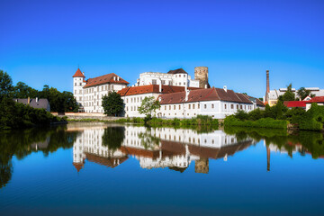 Naklejka na ściany i meble The Vajgar Pond in the Hamersky Potok River at Jindrichuv Hradec in the Czech Republic, with the Famous Castle