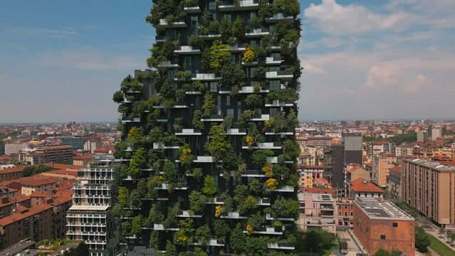 Aerial close up view of ecological modern architecture skyscrapers with green trees on every balcony. Bosco Verticale residential towers in Milan, Italy. 4k Milan city skyscrapers