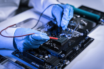 Hands repairing electronic devices. Electronic technician.