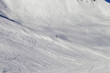 Snowboarder on ski piste - 701734918