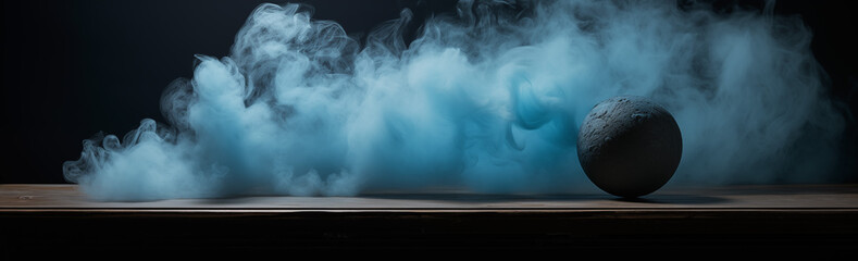 Spherical object amidst swirling blue smoke on dark background