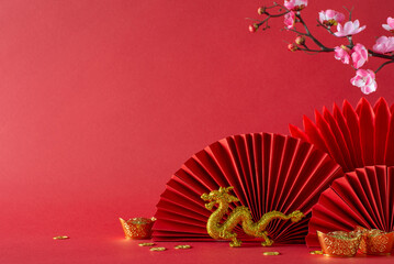 Vibrant Chinese New Year composition: side view feng shui adornments, gold coins, dragon motif, cherry blossoms, fans—set against a red background, inviting text or advertising placement - Powered by Adobe