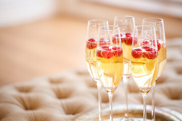 Champagne glasses on silver tray. Party concept