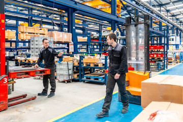 Warehouse and handling workers in a logistic factory