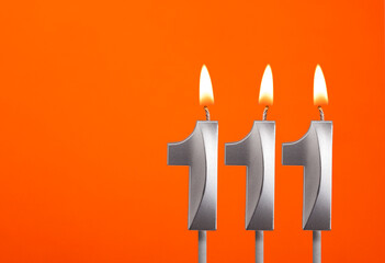 Candle number 111 - Birthday in orange background