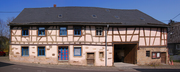 Half-timbered wooden farmhouse in the old village of Leisel, Hunsrück region in Germany