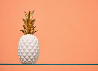 White beautiful luxe pineapple with golden leaves. Copy space for text.