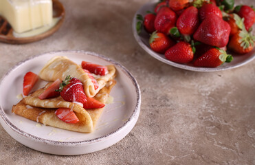 thin pancakes with strawberries for breakfast