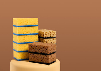 Sponges for dishwashing and cleaning on the podium. Copy space for text.