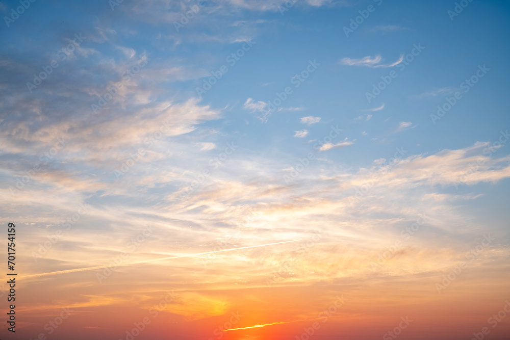 Wall mural beautiful of luxury soft gradient orange gold clouds and sunlight on the blue sky perfect for the ba