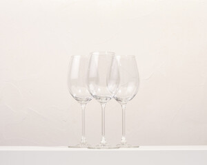 Glass glasses for alcoholic beverages stand on the table. Luxury composition.