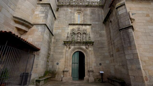 View of the entrance to the Cathedral of Pontevedra - Basilica of Saint Mary Major. Catholic church, dating from the 16th century. Stabilized video. Camera tilt up