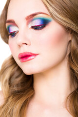 Portrait of a beautiful young blond model with bright make up