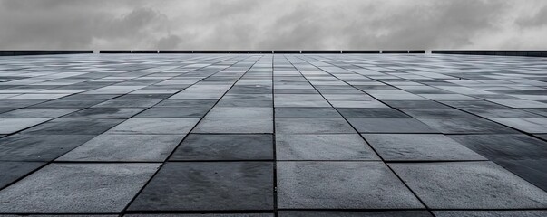 Detailed view of textured square pavement. Cobblestone charm. Vintage patterns on ancient urban path. Concrete symphony. Grey and black pavement in city