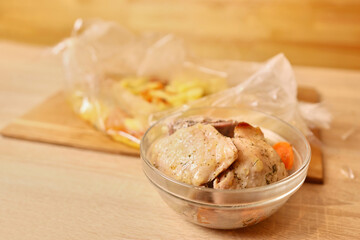Put the baked chicken in the bag (sleeve) on a plate