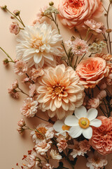 Arrangement of peachy and beige flowers on beige background.