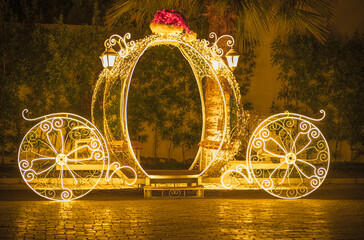 Illumination Cinderella royal carriage. A New Year decoration.