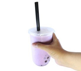 hand holding a cup of boba