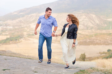 Beautiful happy smiling running couple in love