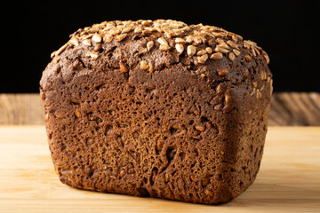 Grain black bread with sunflower seeds. A healthy breakfast.