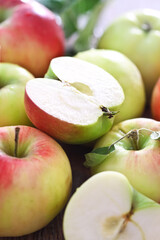 Red and green apples with leaves