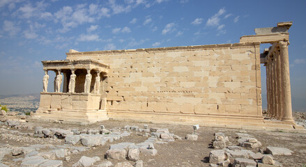 Ancient Parthenon Temple on top of the Acropolis Athens, Greece at sunny day with a blue sky. The landmark of Athens. Parthenon is the temple of for dedication to the goddess Athena.