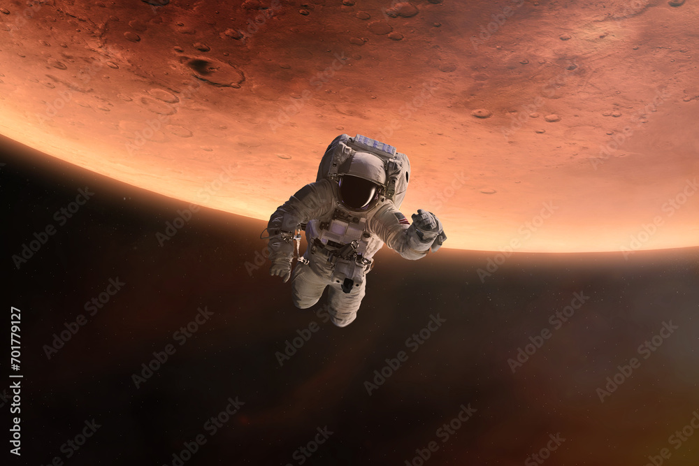 Wall mural astronaut is flying in outer space on mars planet background. elements of this image furnished by na