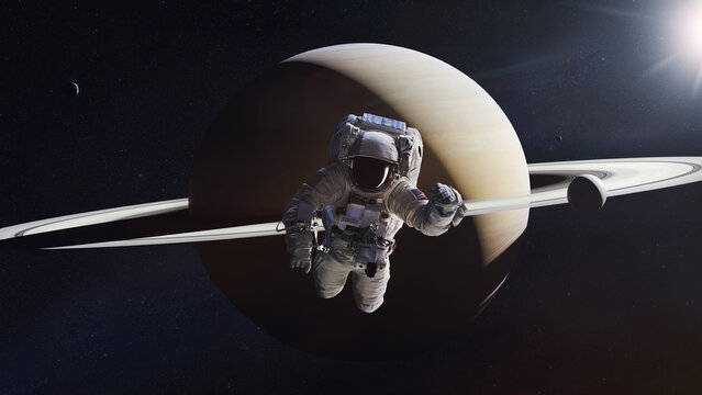 Astronaut in deep space with Saturn planet. Elements of this image furnished by NASA.