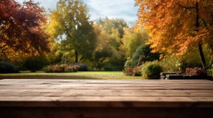 Une table en bois avec en arrière-plan un magnifique paysage d'automne dans une nature ensoleillée - obrazy, fototapety, plakaty