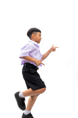 finger point up and side. Thai school uniform with backpack bag. Portrait Young Asian cute boy standing on white studio background banner. Back to school.
