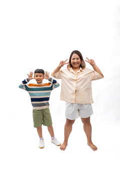 Portrait asian thai mother and son smile and happy standing on white backgrounds banner. Fat and overweight fat woman