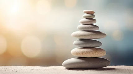 Gartenposter Steine ​​im Sand The art of balance is represented by stacks of zen stones and sand in the background.