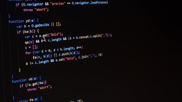 Code. Colorful jsx javascript computer programming code scroll close up pixel detail shot 4K super macro on screen.