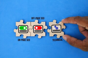 wooden puzzle with icons and words on page seo, off page seo and technical