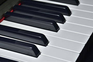 Closeup of Piano keyboard side view perspective. Musical instrument. Black and white piano keys